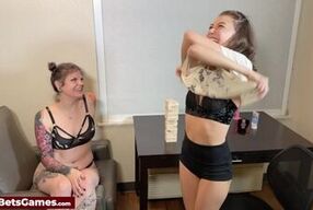 Skinny lesbians play a Jenga strip game