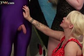 Blonde CFNM gets a hot public handjob from her British group of kinky babes