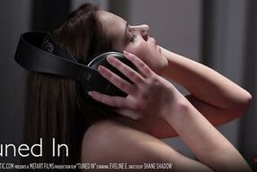 Eveline, the cute brunette, plays her favorite music while pleasuring herself to orgasm