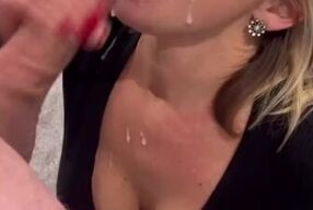 Blonde MILF chokes on bull's massive cock and takes a cumshot on her face