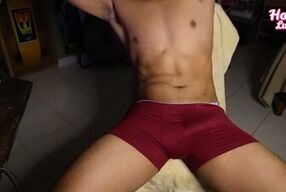 fit boy takes off his boxers to masturbate watching porn
