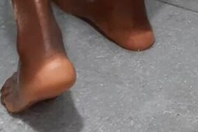 Ebony in wet pantyhose in the shower.